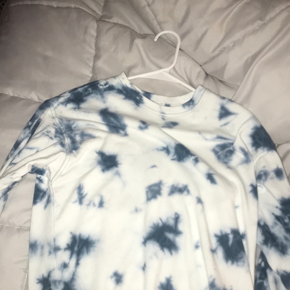 a white long sleeve with blue splashes